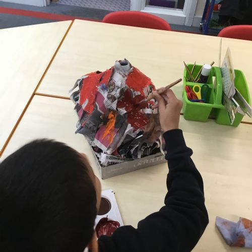 Painting our paper mache volcanoes we built last week! 