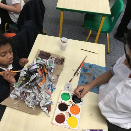 Painting our paper mache volcanoes we built last week! 